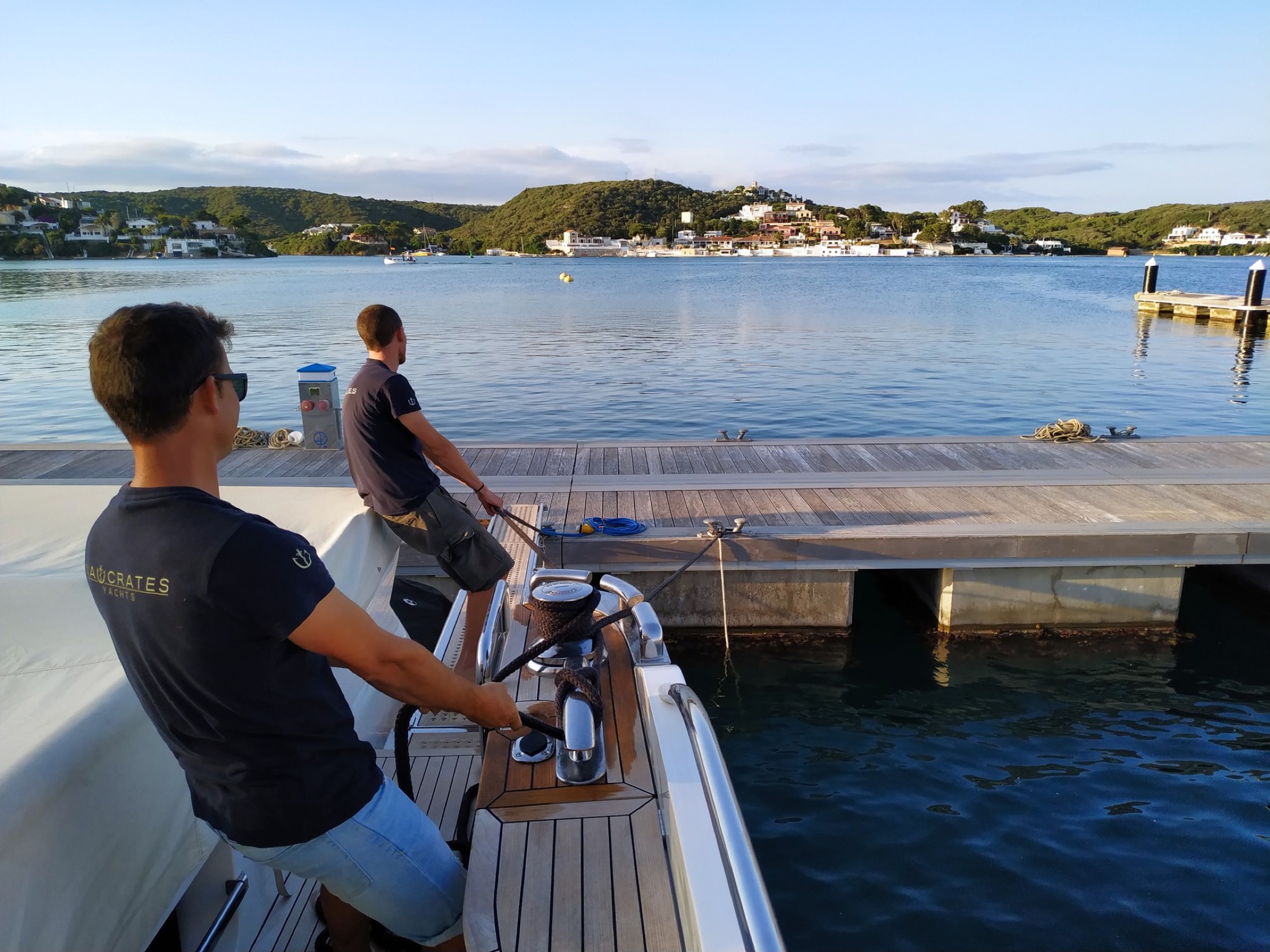 Crew at work on Menorca's north coast moorings
